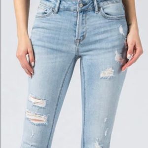 Mid rise light wash ripped skinny jeans